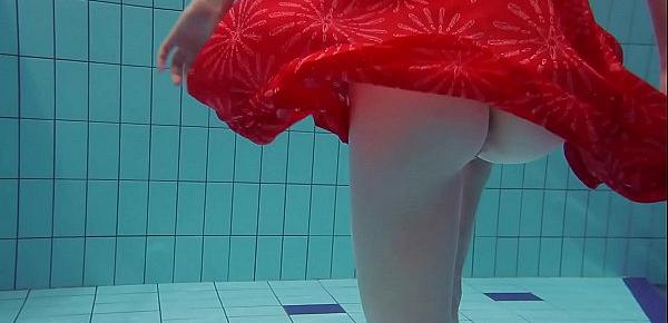  Red Dressed teen swimming with her eyes opened